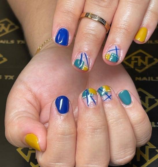 cute short blue nails with abstract nail art