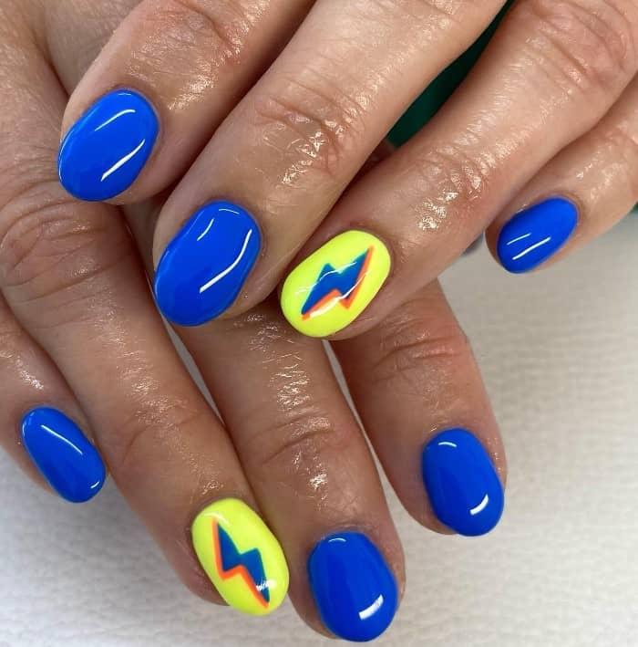 bright and bold with neon yellow and blue nails in electric shades with a dazzling glossy finish