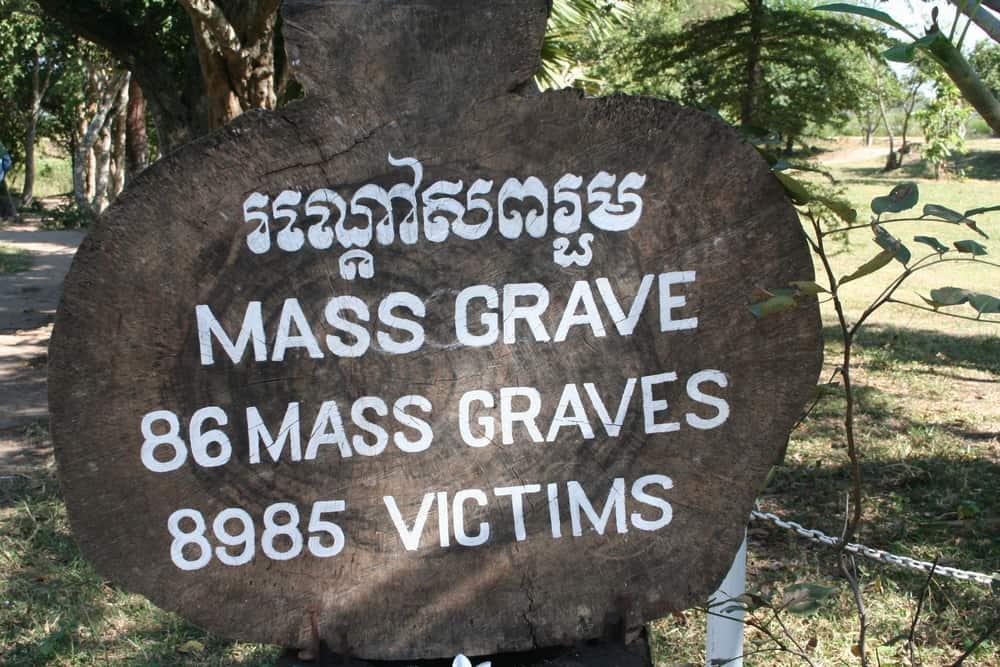 Cambodia - Phnom Penh - mass grave sign at the killing fields in Cambodia. Where more than 8900 victims, including women and children, were brutally murdered and buried in mass graves