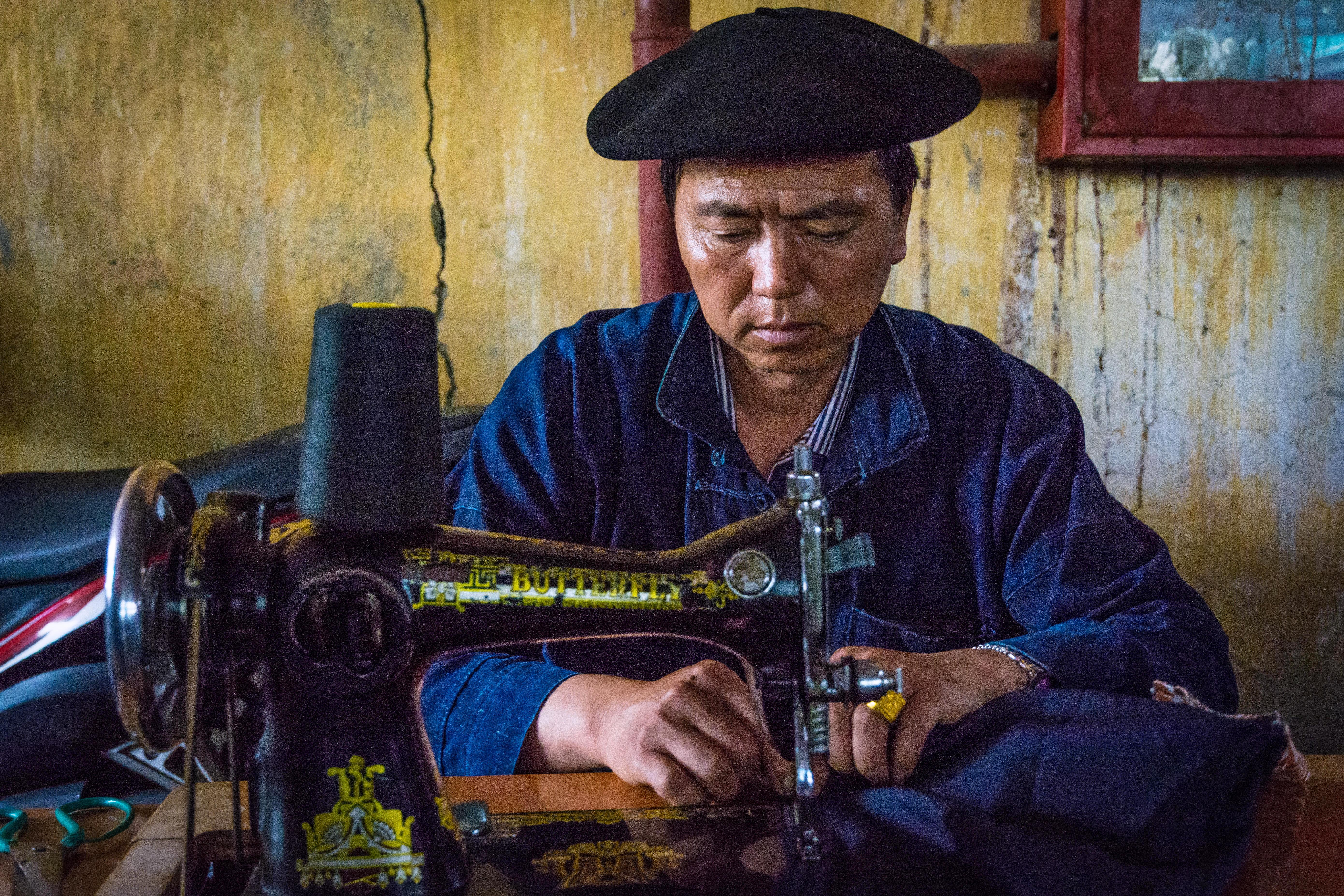 A tailor at work at the Meo Vac market in Ha Giang Province (Alamy)