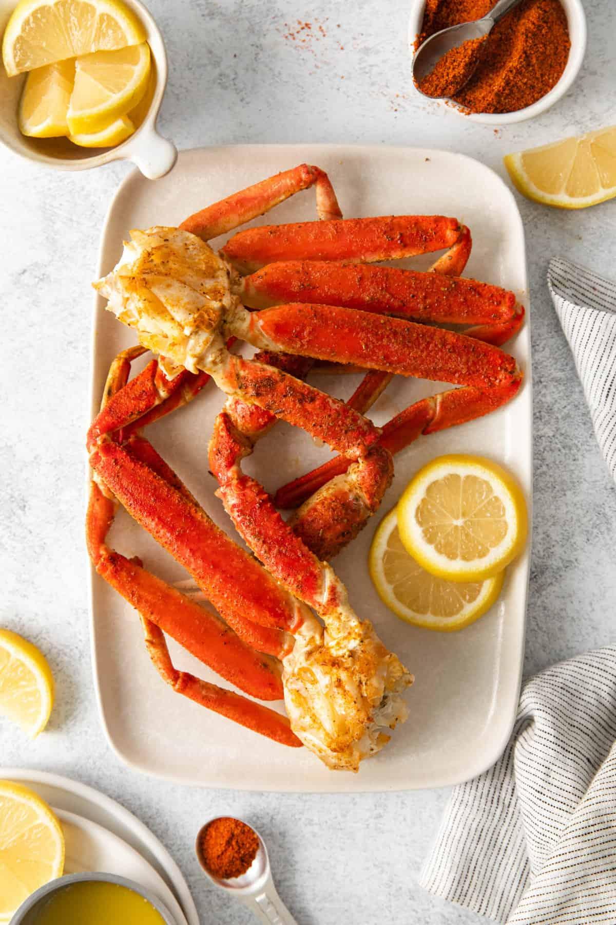 A large rectangular platter with snow crab legs.