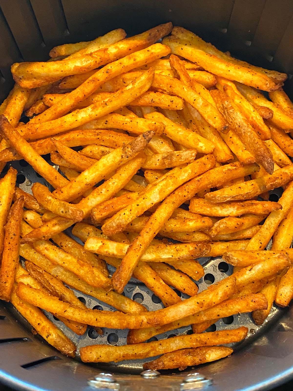 Cooked french fries in an air fryer.