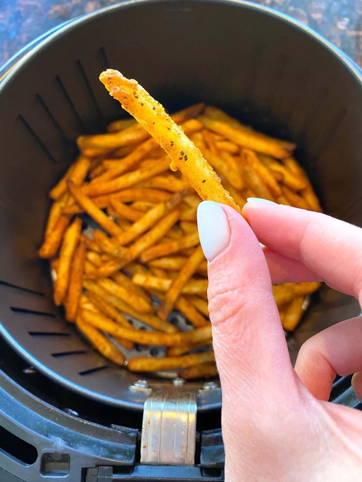 Cooked french fries in an air fryer.
