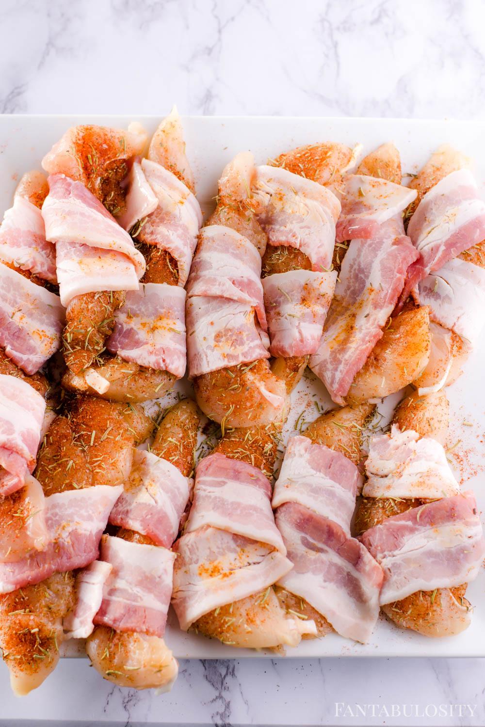 Wrap chicken tenders in bacon