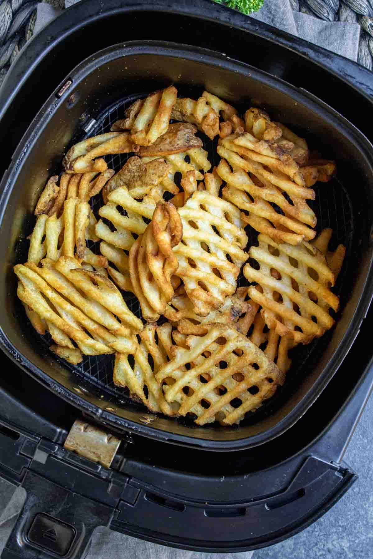 Waffle Air Fryer Frozen French Fries in air fryer basket