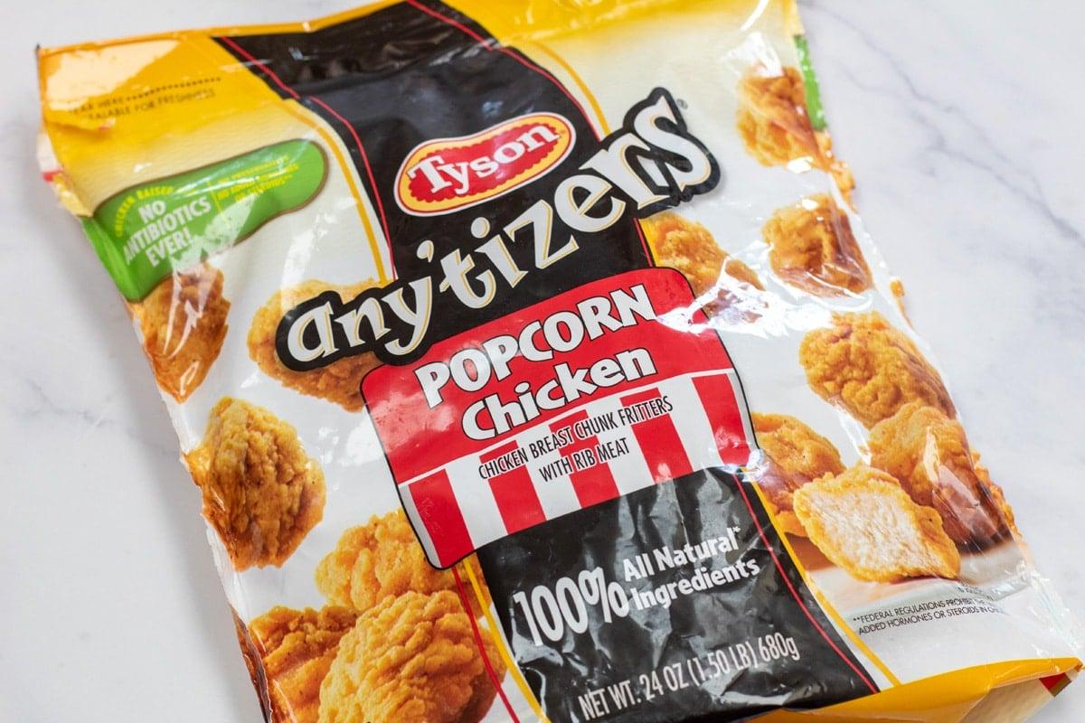 Photo showing bagged frozen popcorn chicken.