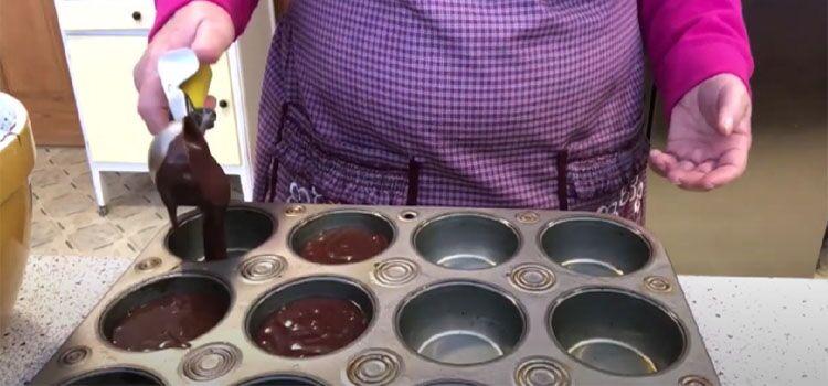 Woman Making Brownies In A Muffin Pan