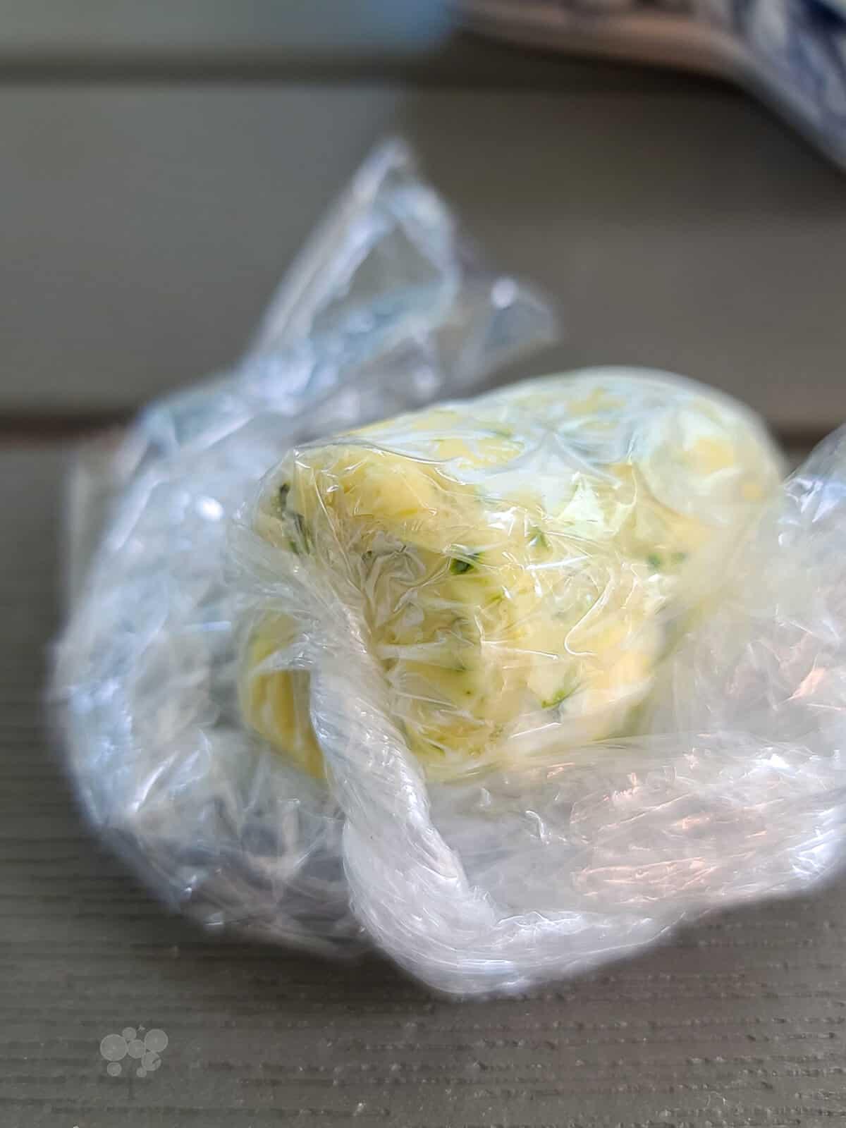 compound lemon butter wrapped in plastic wrap