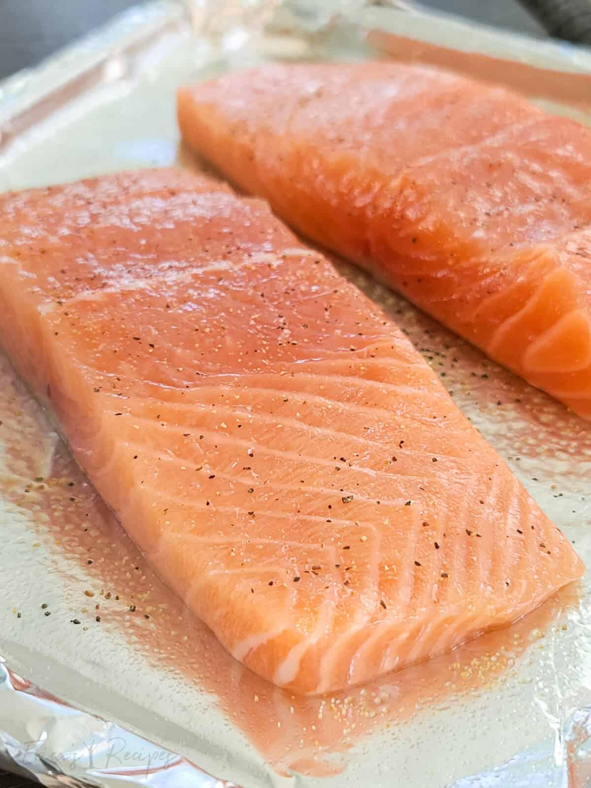 raw salmon on bake pan