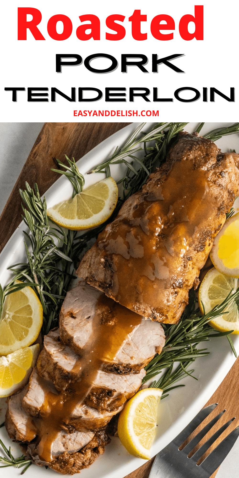Close-up of roasted pork tenderloin garnished with lemon and rosemary.