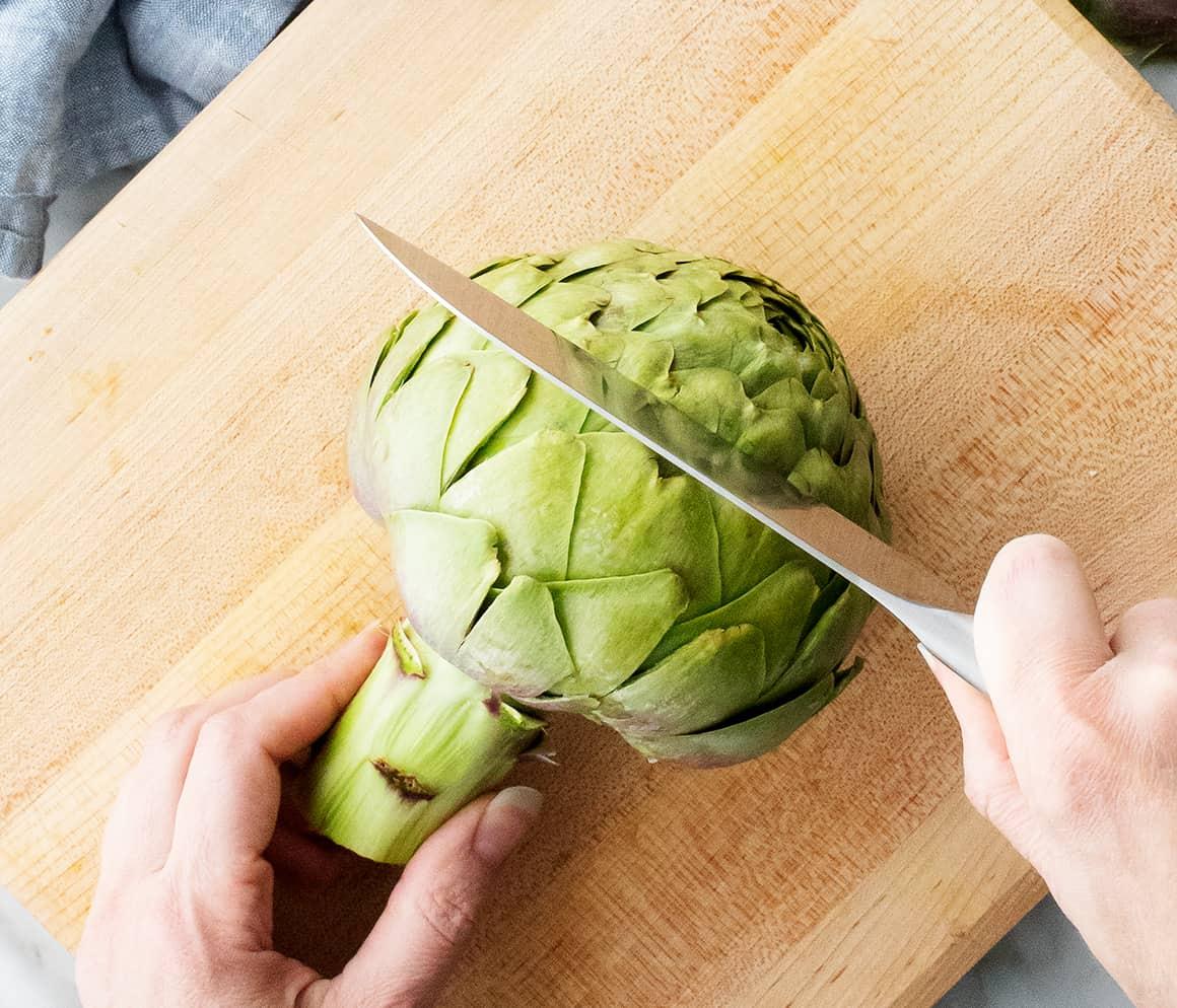 How to prepare an artichoke - slicing off the top with a knife