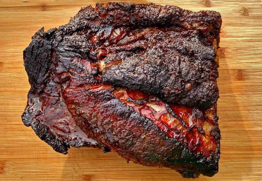 Low and slow is the key to perfectly smoked brisket with a crusty bark and pink smoke ring. Learn how to smoke a brisket on a charcoal grill!