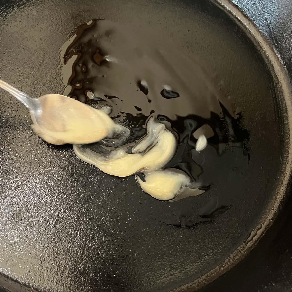 fat melting in cast-iron skillet