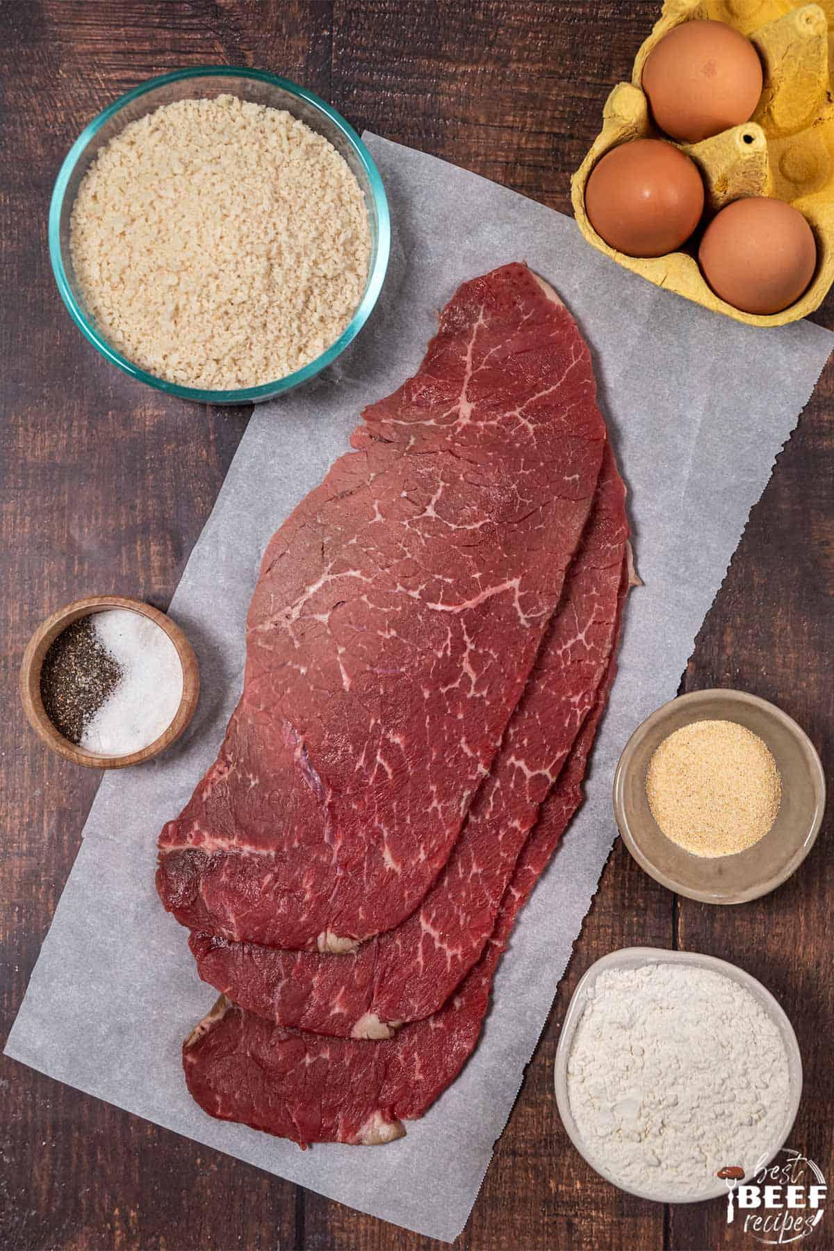 thin steaks on parchment paper