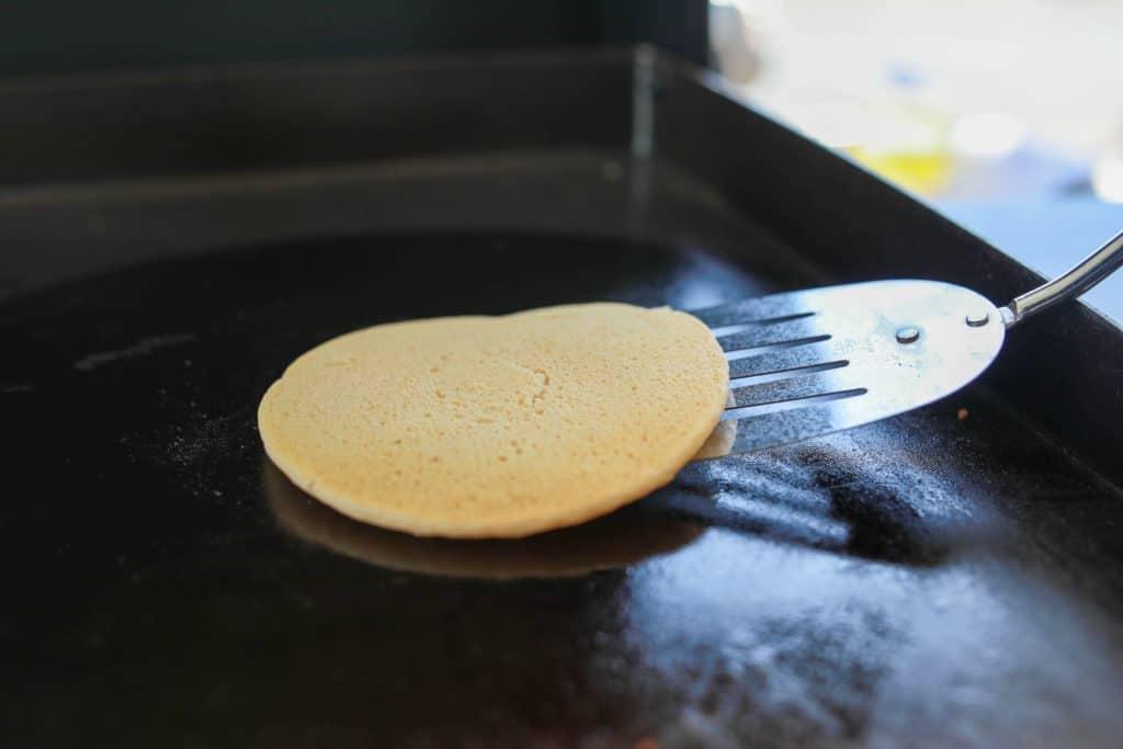 Flipping Blackstone pancakes.