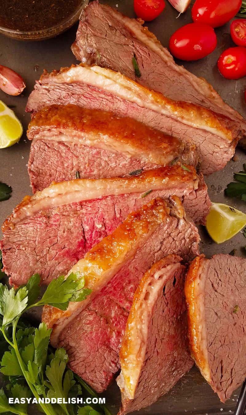 sliced oven baked rump cover or culotte with garnishes