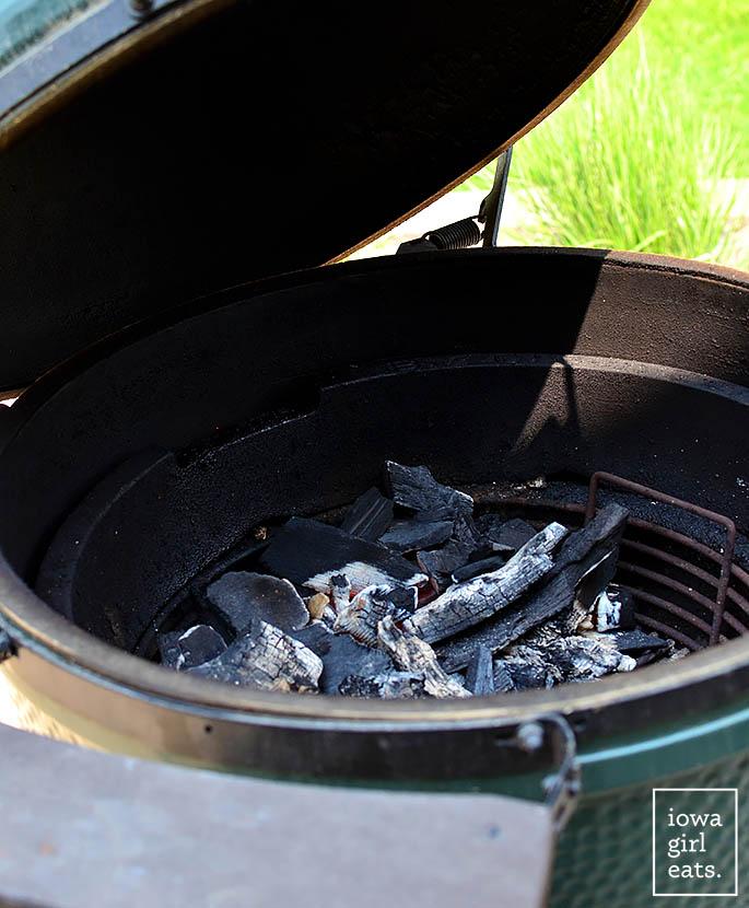 a big green egg with charcoal inside