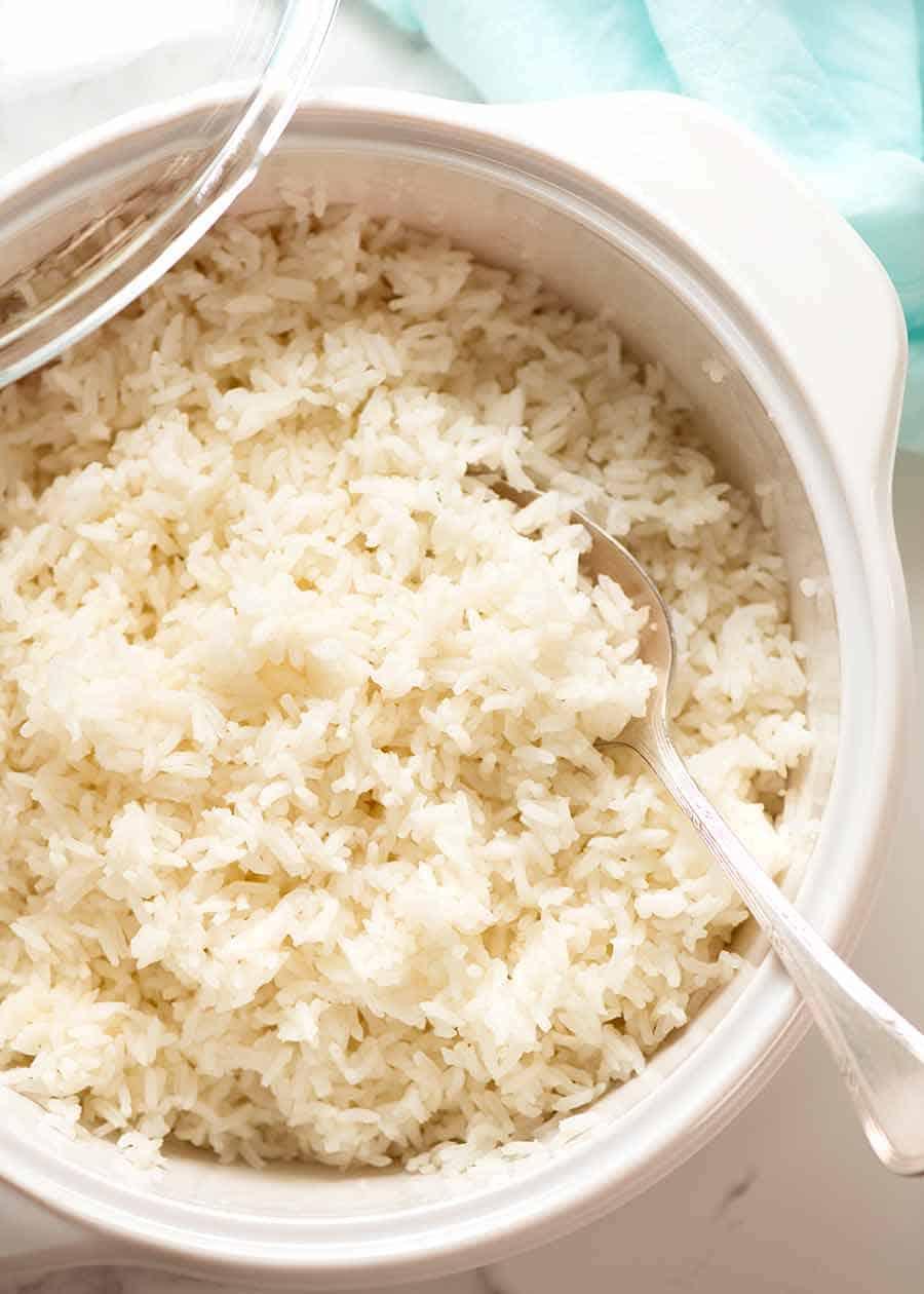 Photo of oven-baked white rice in a casserole pot, fresh out of the oven ready to serve