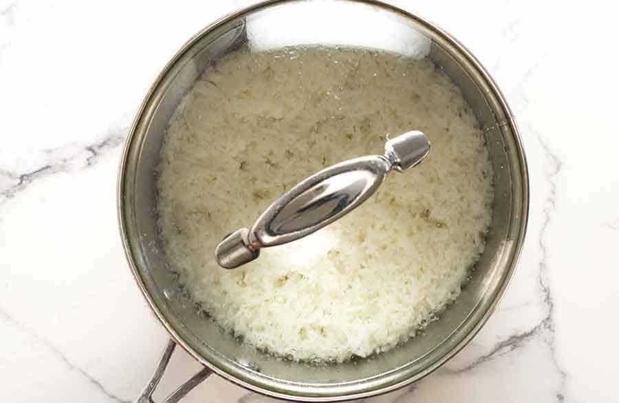 Resting rice in saucepan before fluffing it up
