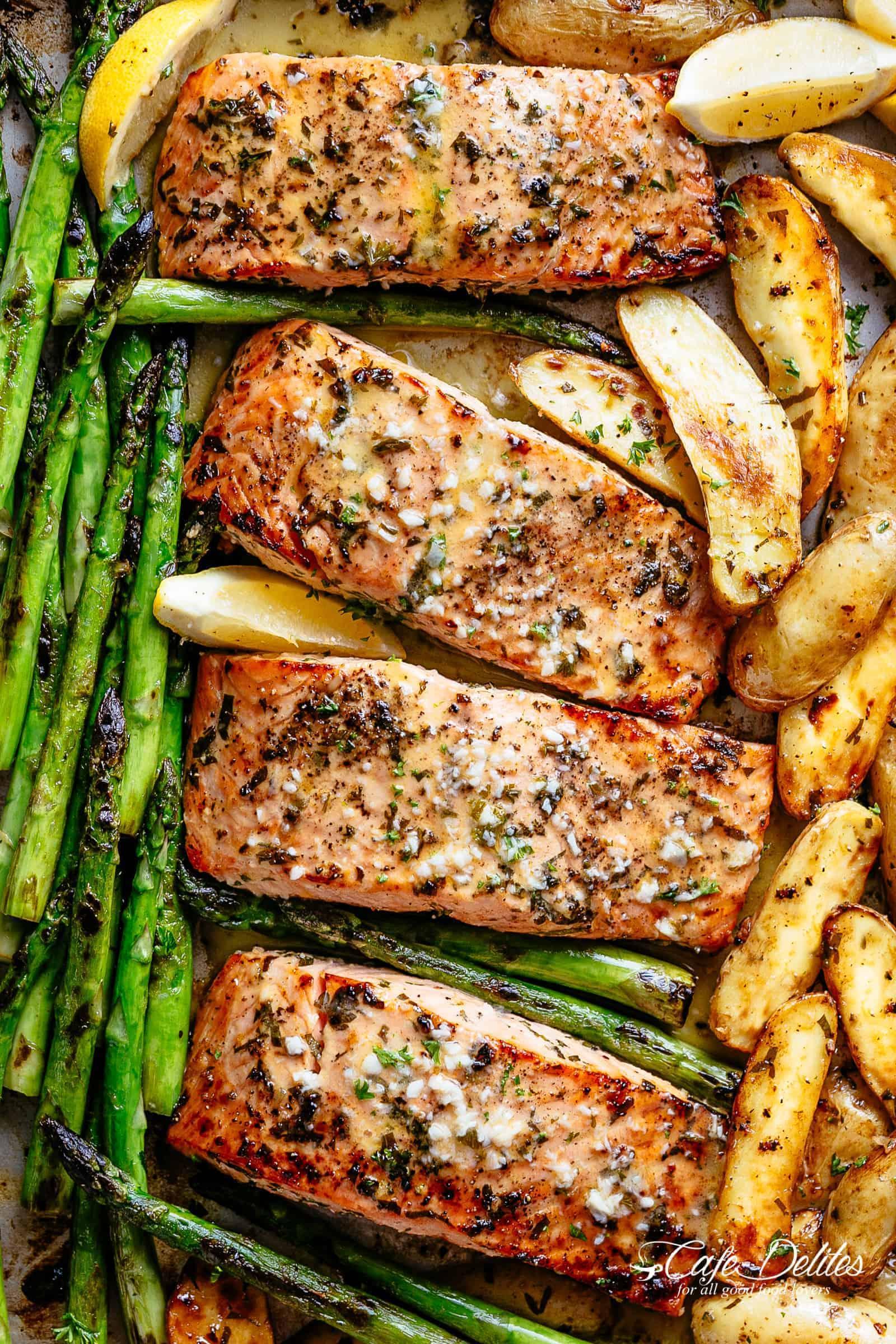 Sheet Pan Garlic Butter Baked Salmon with crispy potatoes, asparagus and a garlic butter sauce with a touch of lemon