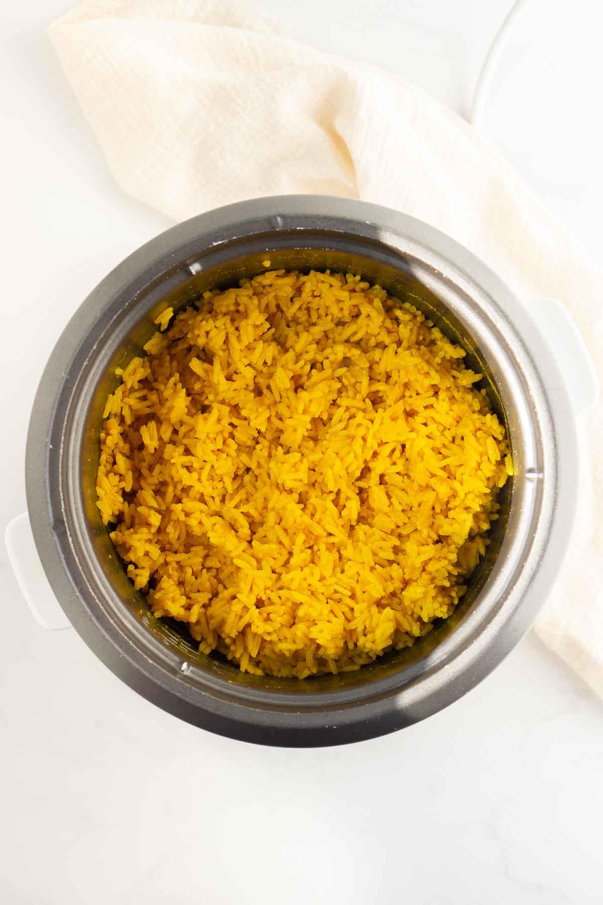 Cooked turmeric rice in the rice cooker