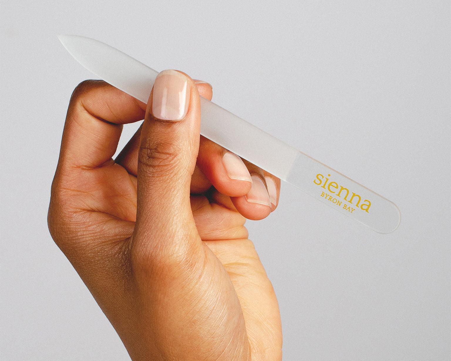 hand holding glass nail file