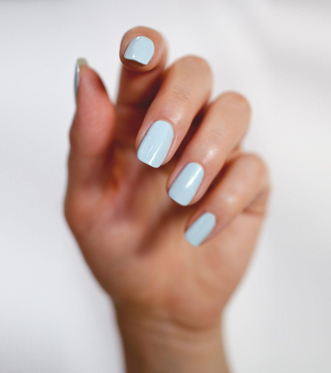 squoval nail shape with pastel blue nail polish