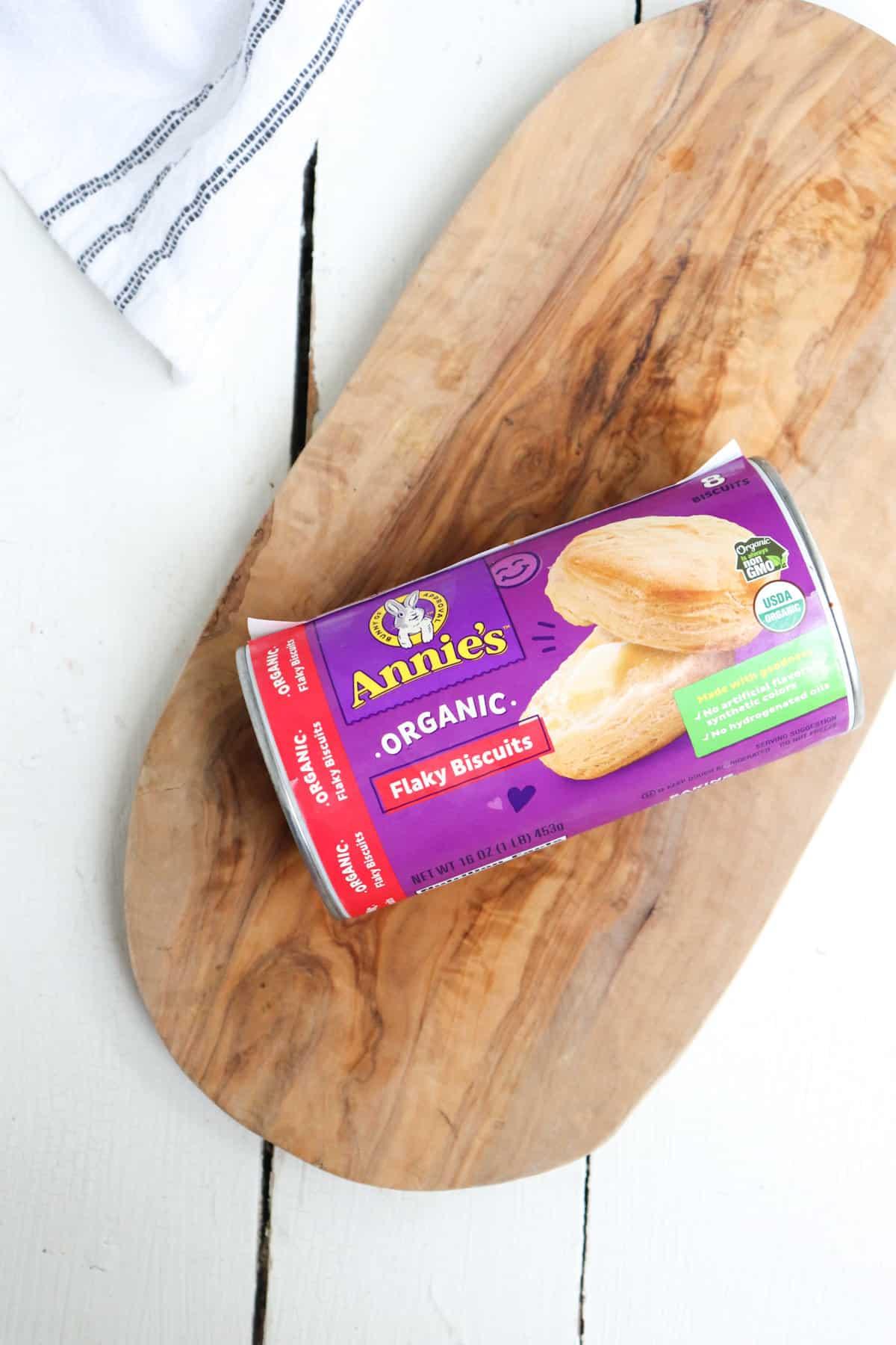 can of annies refrigerator biscuits on a wooden board.