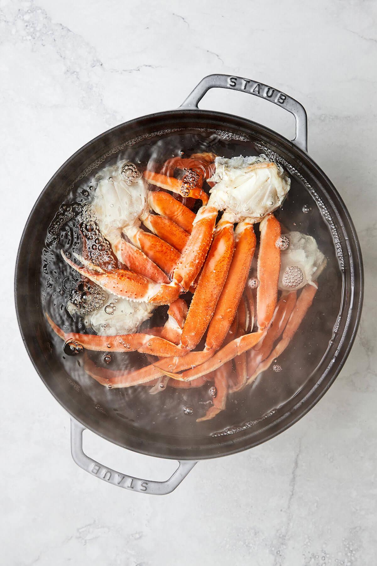 Boiling crab legs in a pot