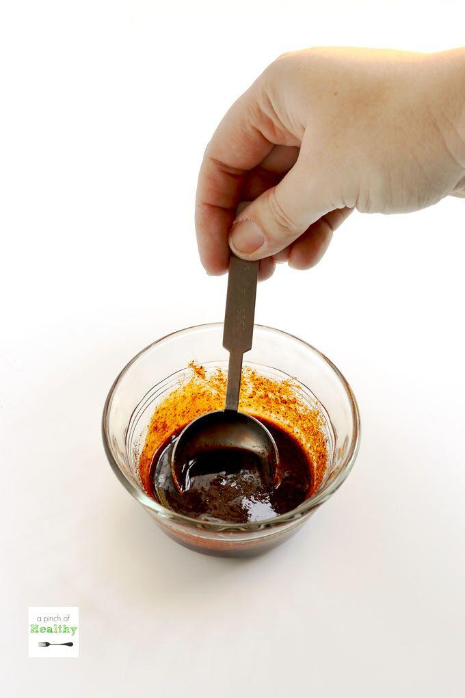 mixing seasoning and oil in a small glass bowl