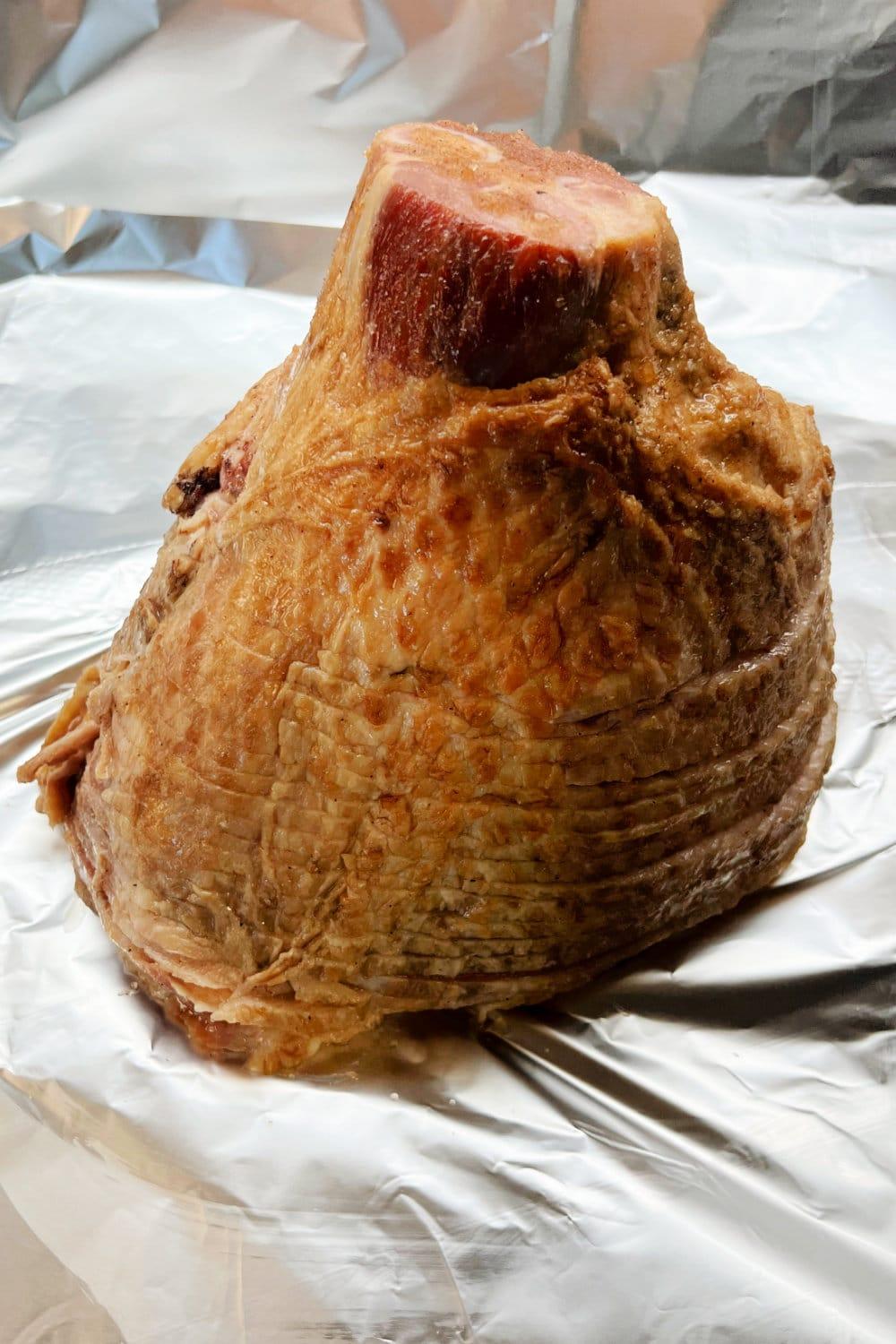 A spiral ham ready to be wrapped in foil.