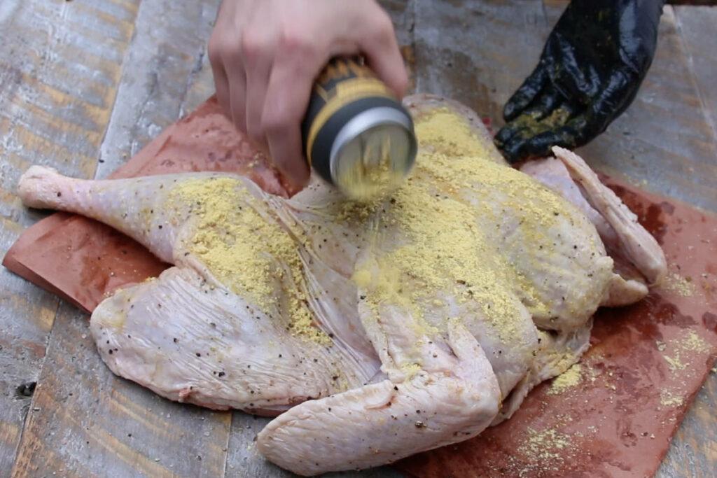 Coat the turkey in olive oil and season with your favorite turkey rub.