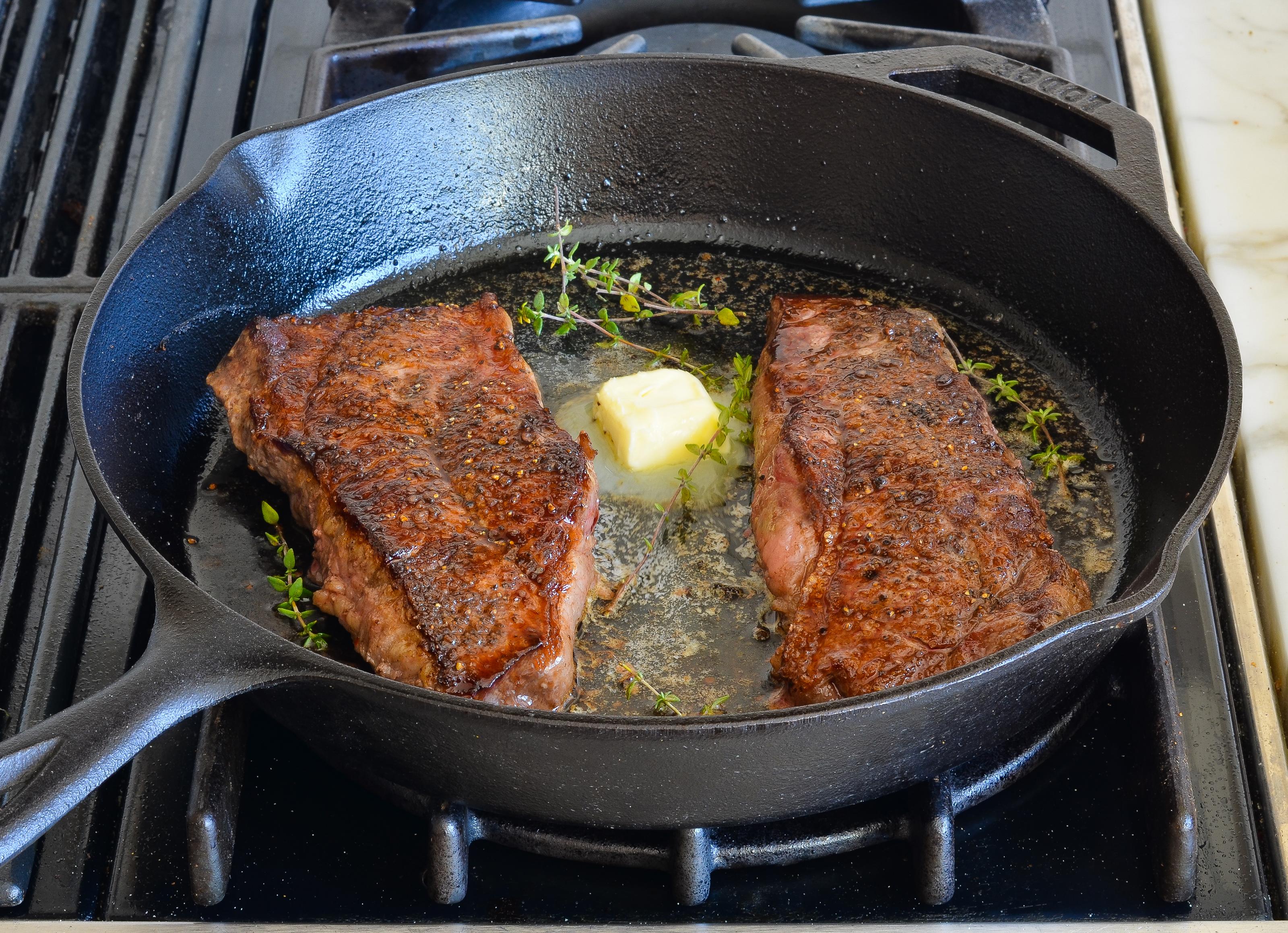 Pan-sear steaks with butter and thyme