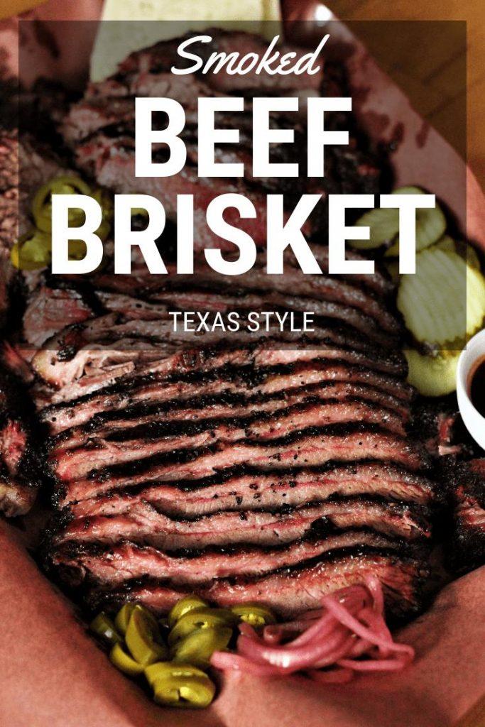 sliced texas style smoked beef brisket on peach butcher paper.
