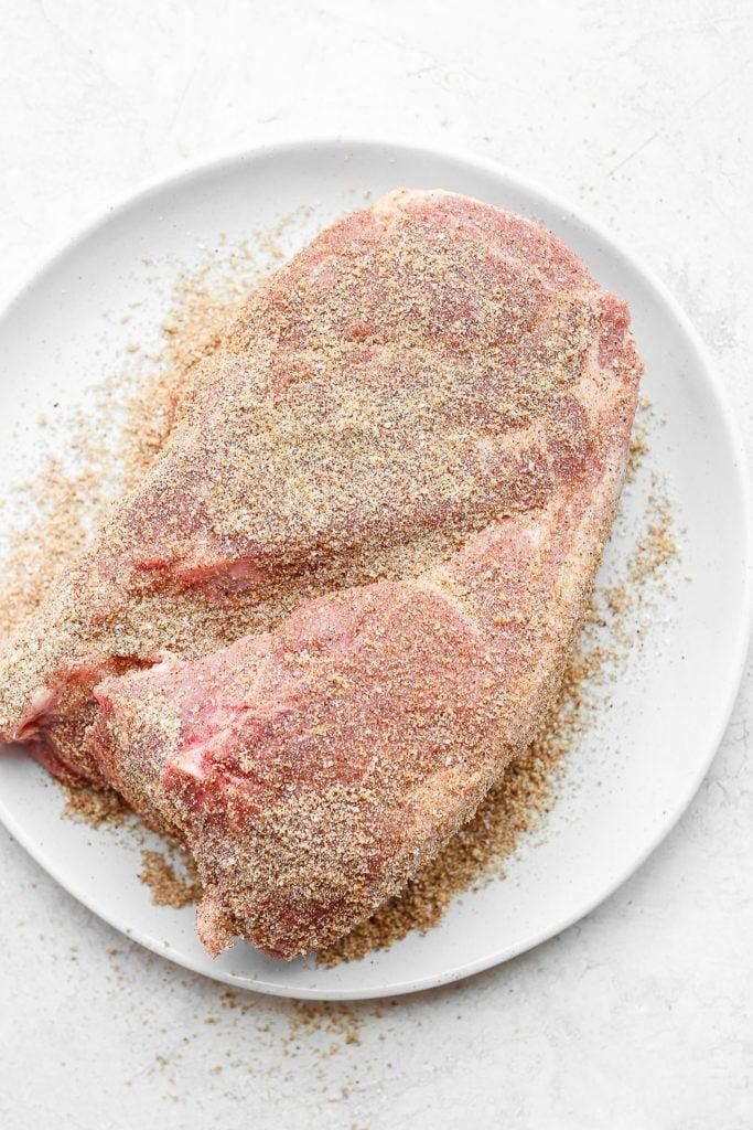 pork shoulder patted with dry rub