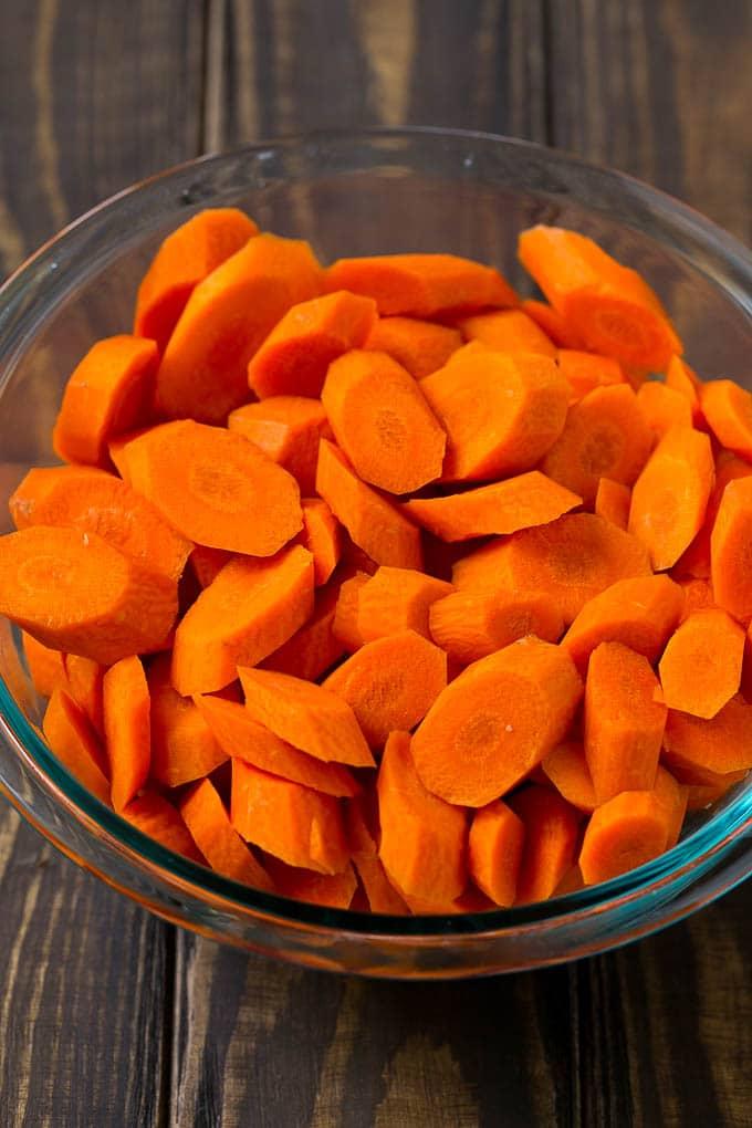 A bowl of peeled and sliced carrots.