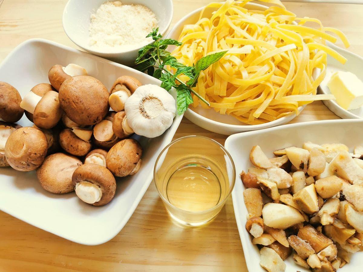 ingredients for tagliatelle with porcini on wood work surface