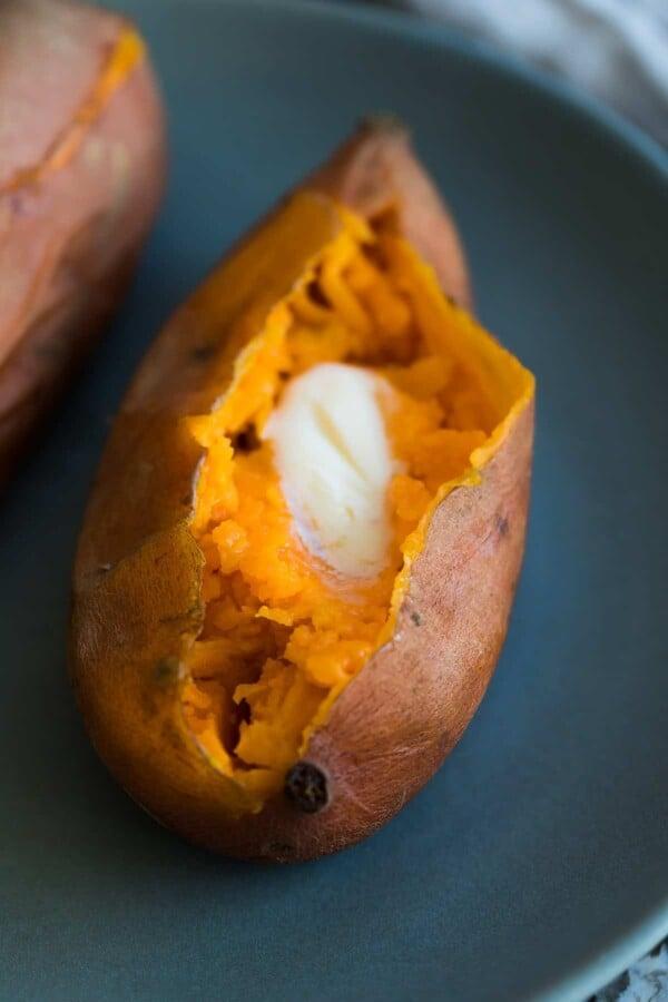 sweet potato on a plate with melted butter