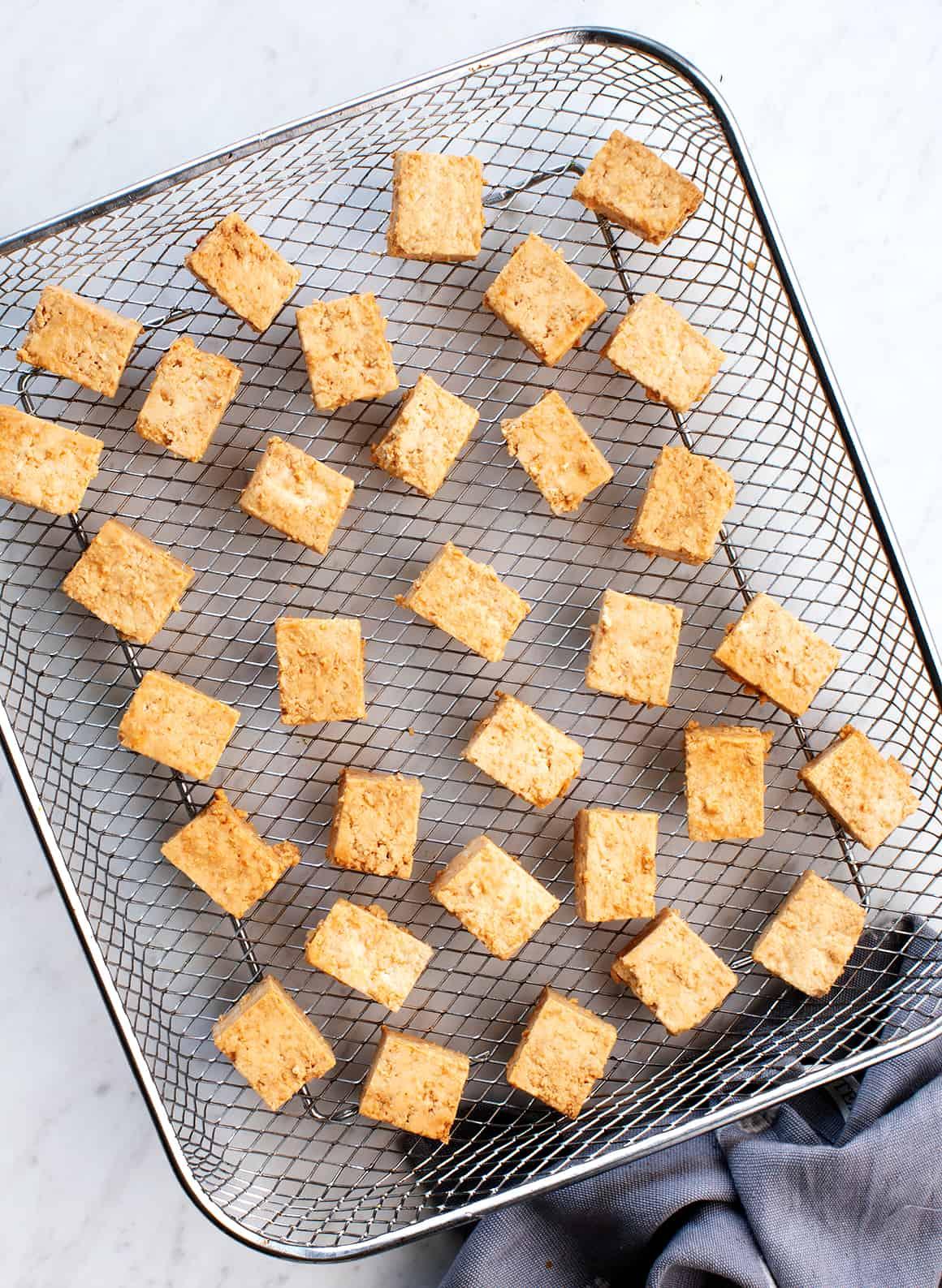 Cubed tofu in air fryer basket