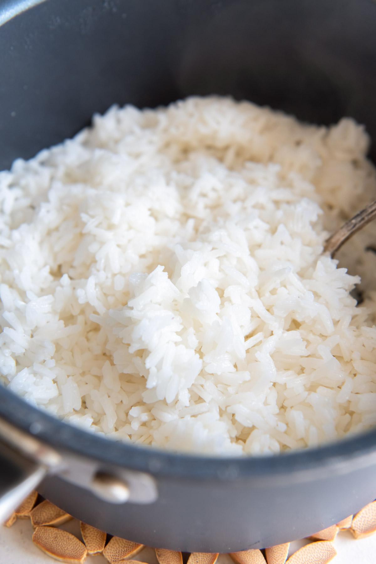 Fluffy cooked white rice in a pot