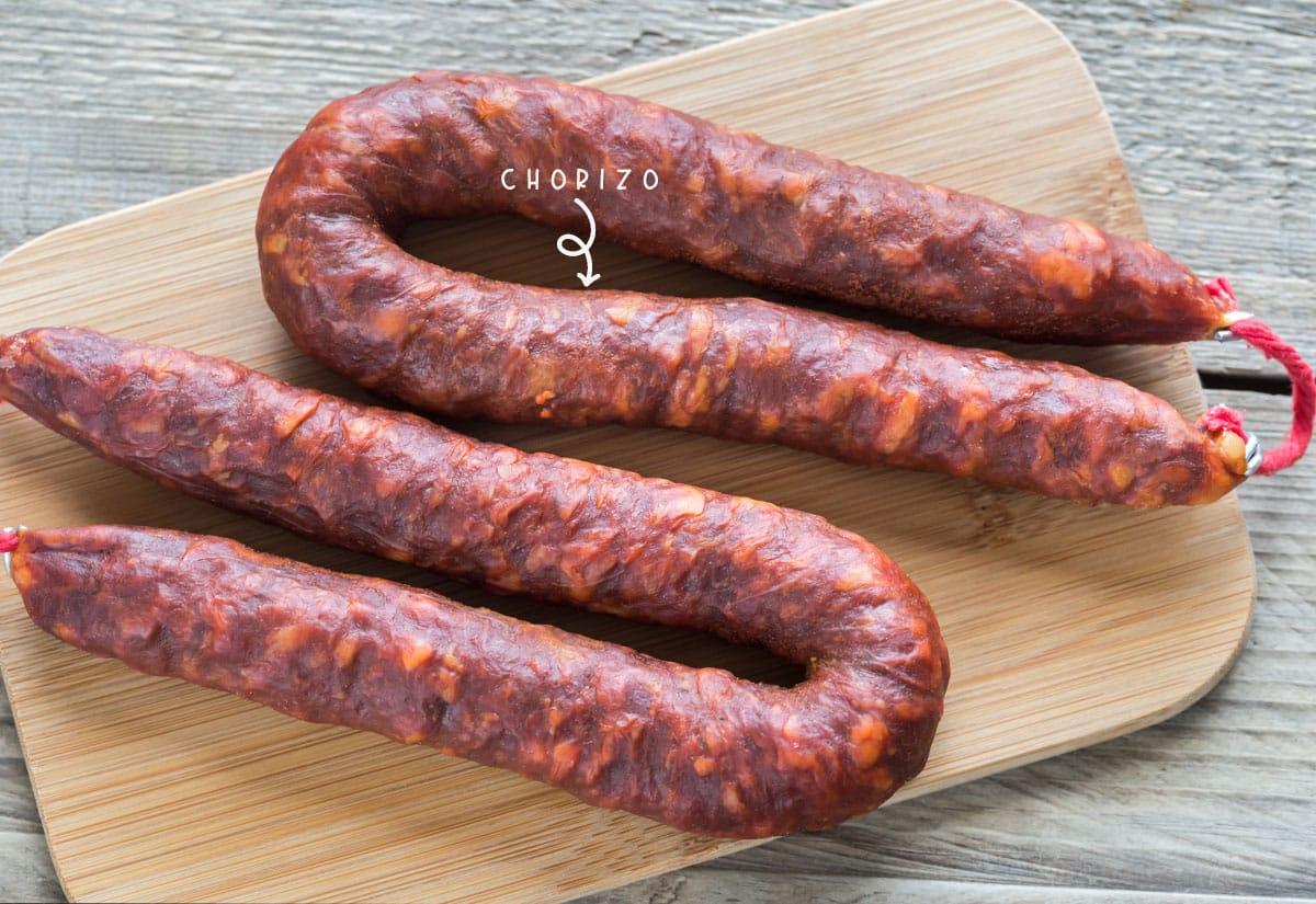 Compared to other types of chorizo, Spanish chorizo is dryer and firmer, semi-cured or cured chorizo with a strong, smoky flavor and needs to simmer